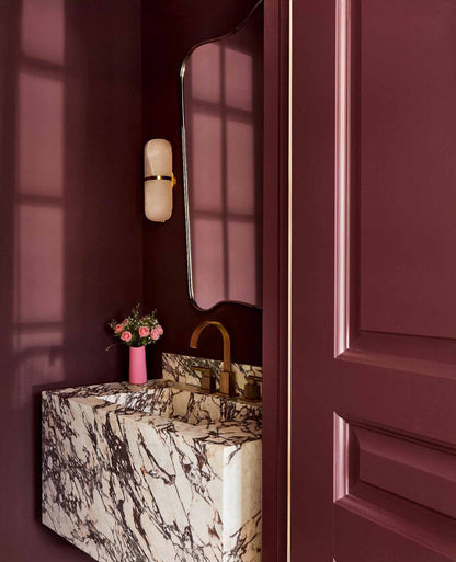  gold brass mirror in powder room 