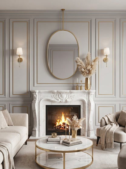 Oval brass hanging mirror above marble fireplace mantel.