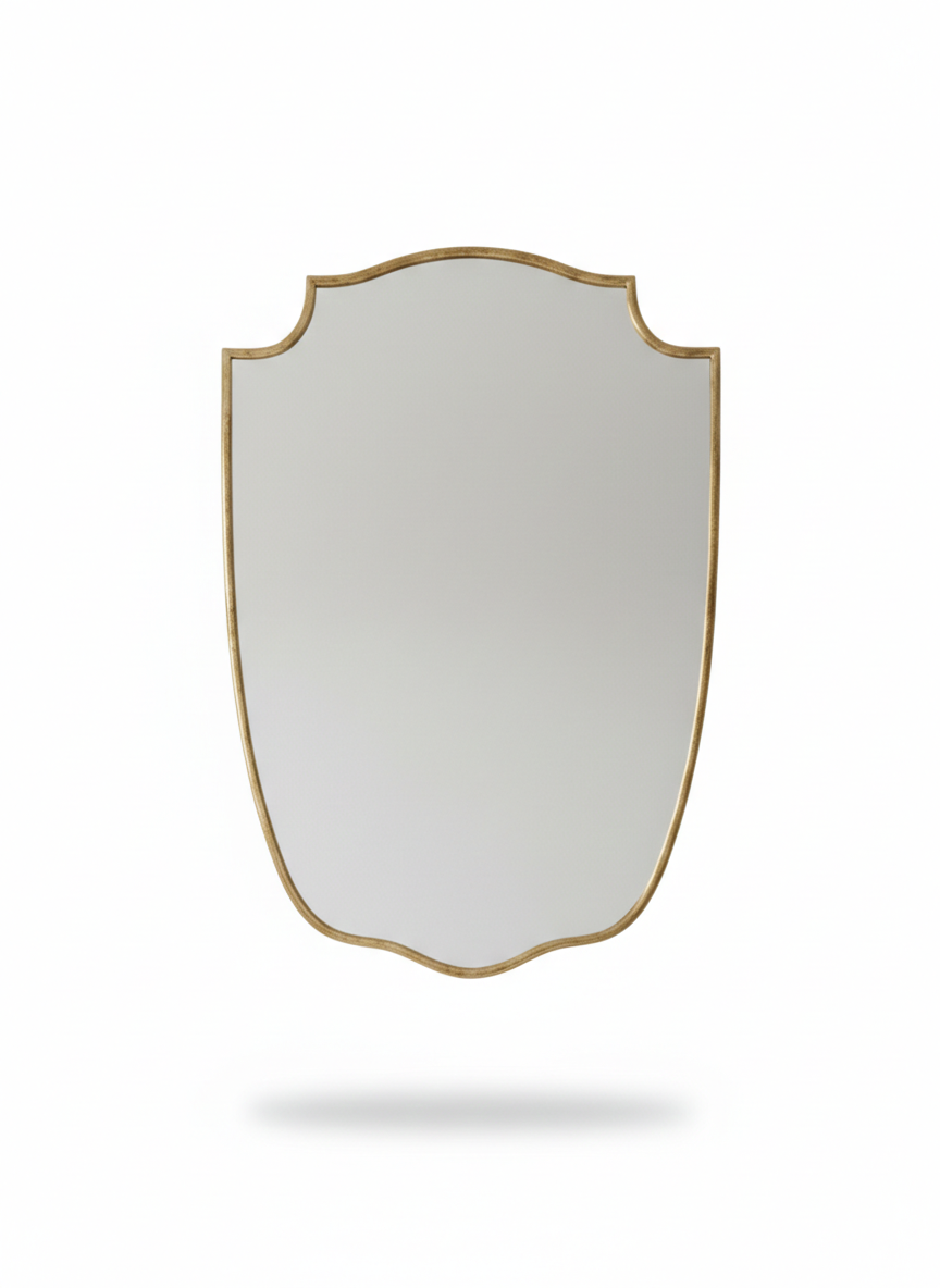 Gold shield mirror isolated on white background.