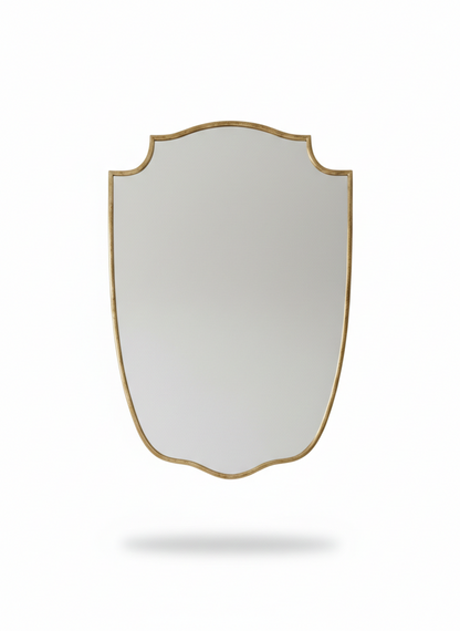 Gold shield mirror isolated on white background.