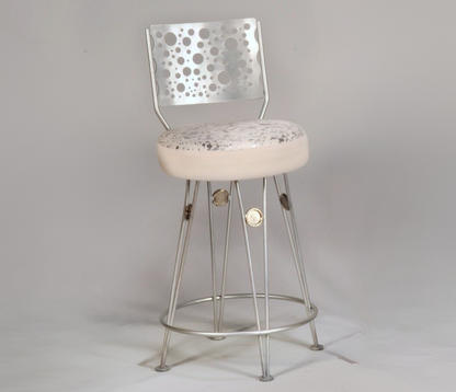 Bar stool with perforated backrest and floral cushion on a gray background