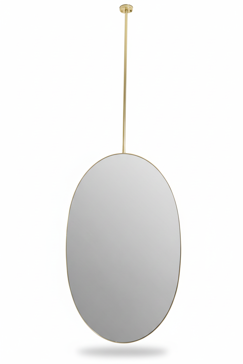 Minimal oval brass mirror suspended from ceiling in a white background