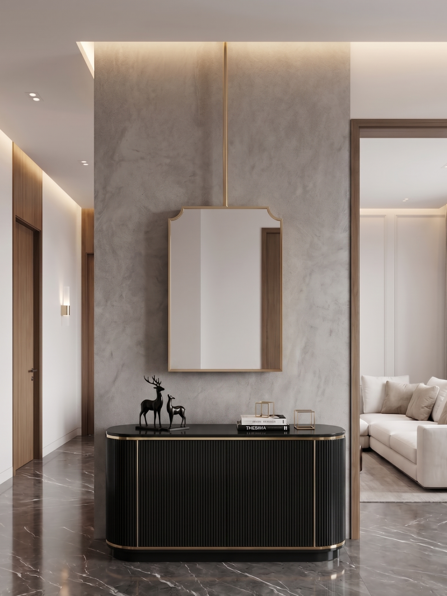 Hanging brass mirror above black console in contemporary hallway.