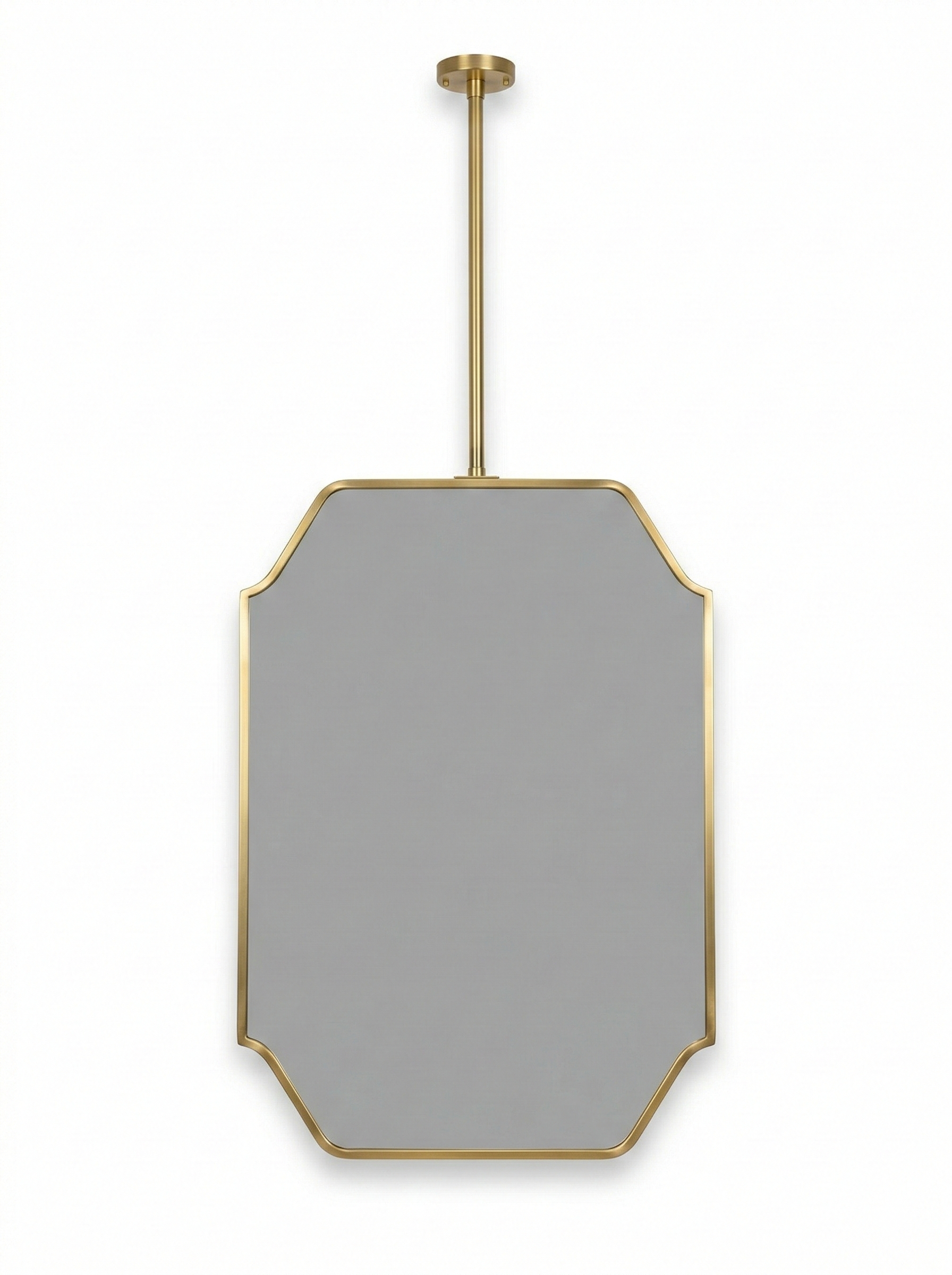 Close-up of modern suspended brass mirror with geometric art deco frame.