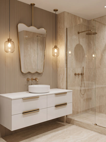 Ceiling mounted scalloped brass mirror above a modern floating vanity.