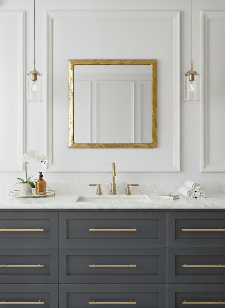 Modern bathroom vanity with square brass framed mirror