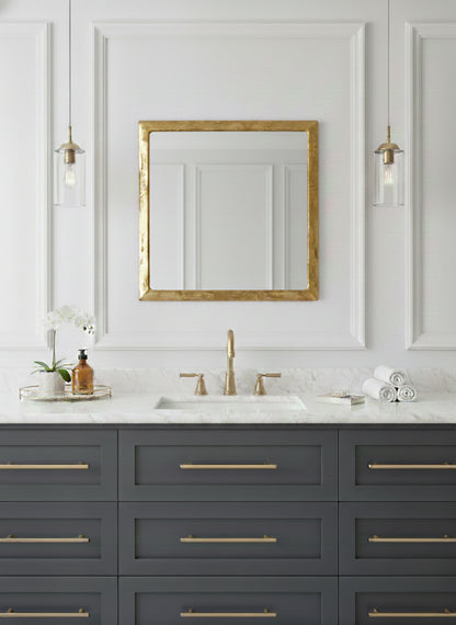 Modern bathroom vanity with square brass framed mirror