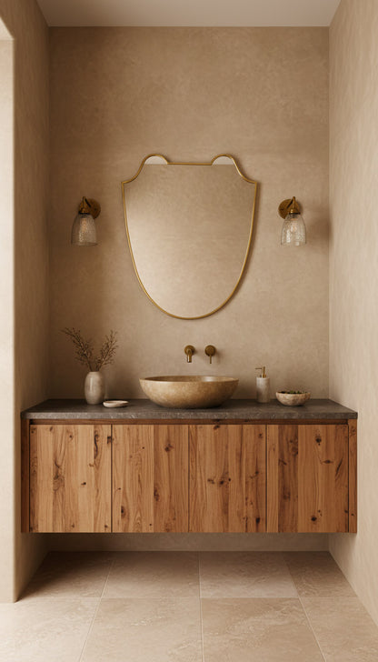 Brass Italian shield mirror over rustic wood bathroom vanity.
