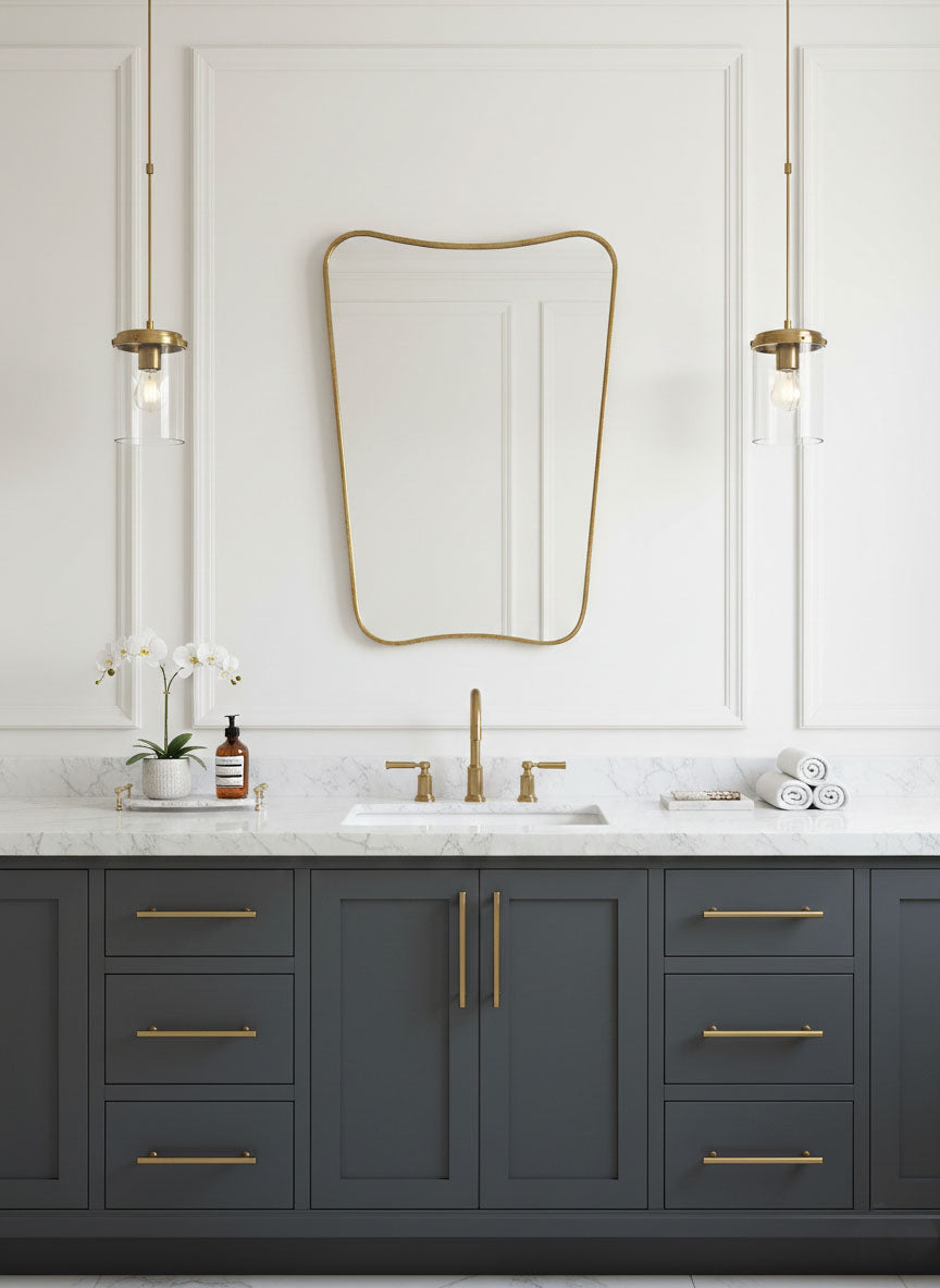 Butterfly brass mirror above double bathroom vanity