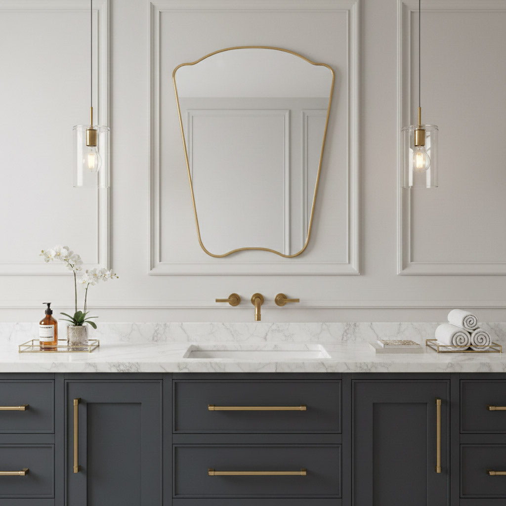 Italian irregular brass mirror over marble sink with classic wall paneling