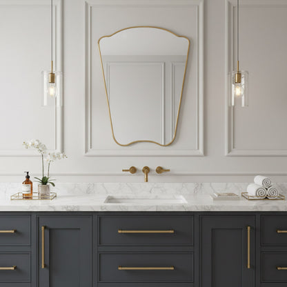 Italian irregular brass mirror over marble sink with classic wall paneling