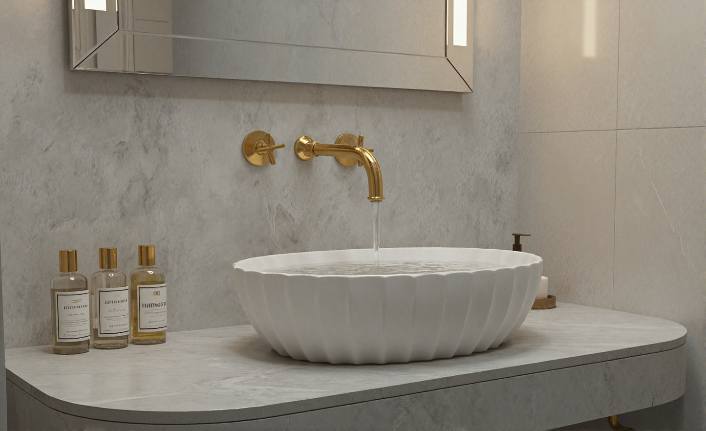 White fluted vessel sink with brushed brass wall faucet and mirror