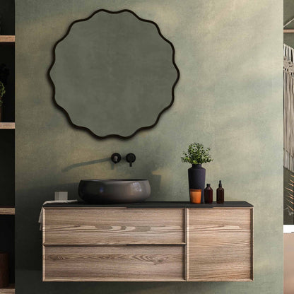 a bathroom vanity with a round Wavy Mirrors above it