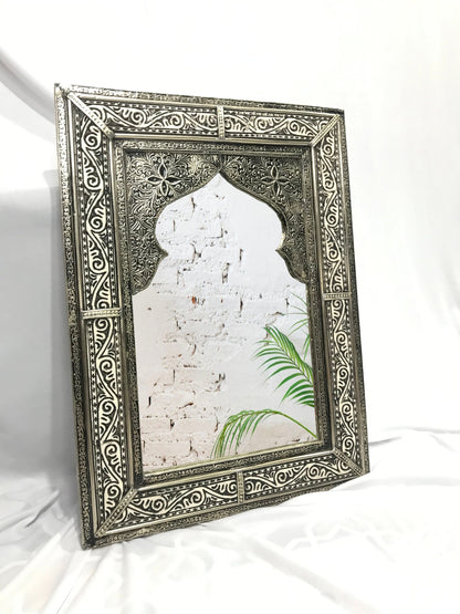 a picture frame with a picture of a building and a palm tree