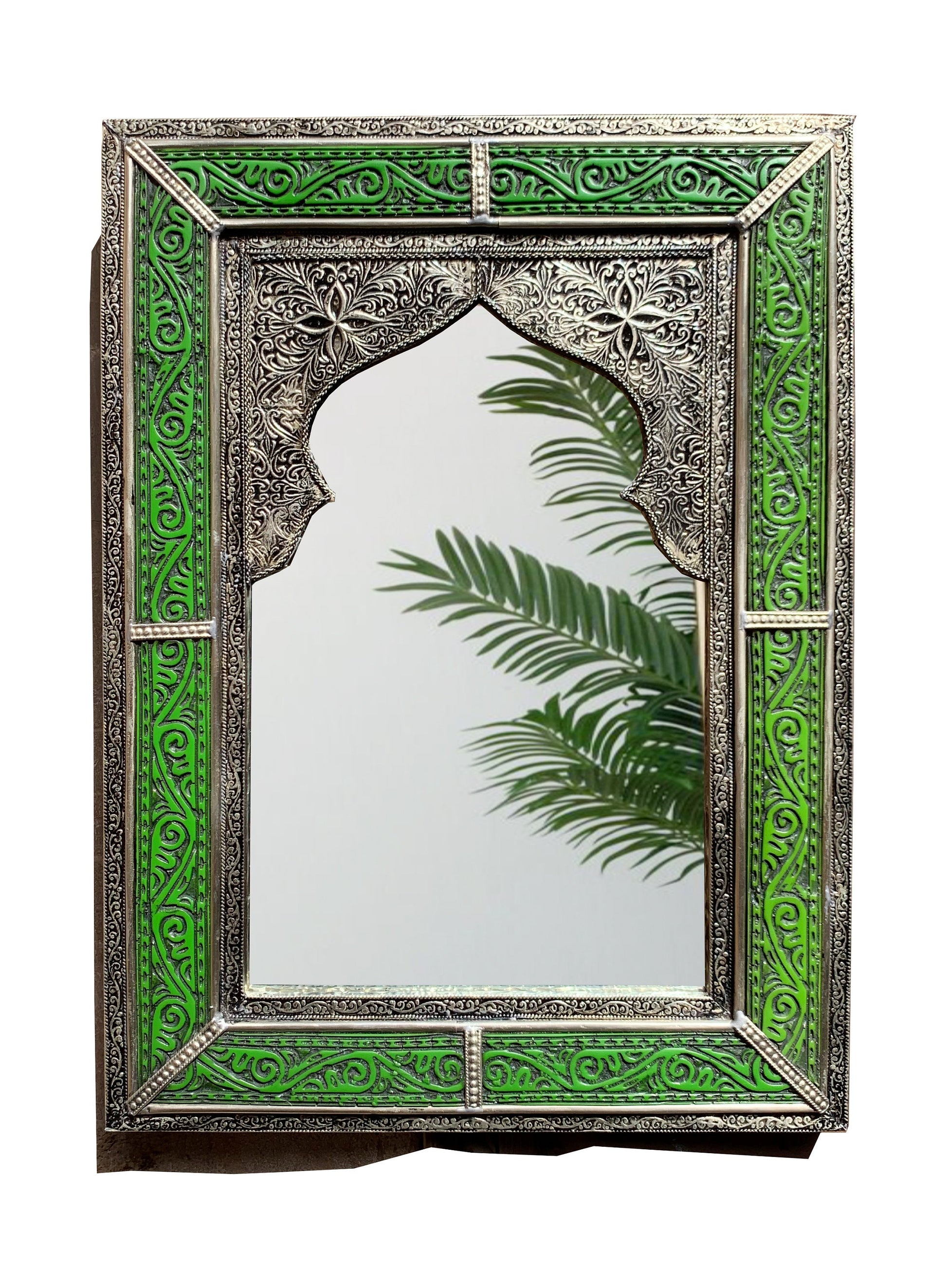 a mirror with a palm tree in the middle of it