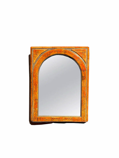 a mirror that is sitting on a wall