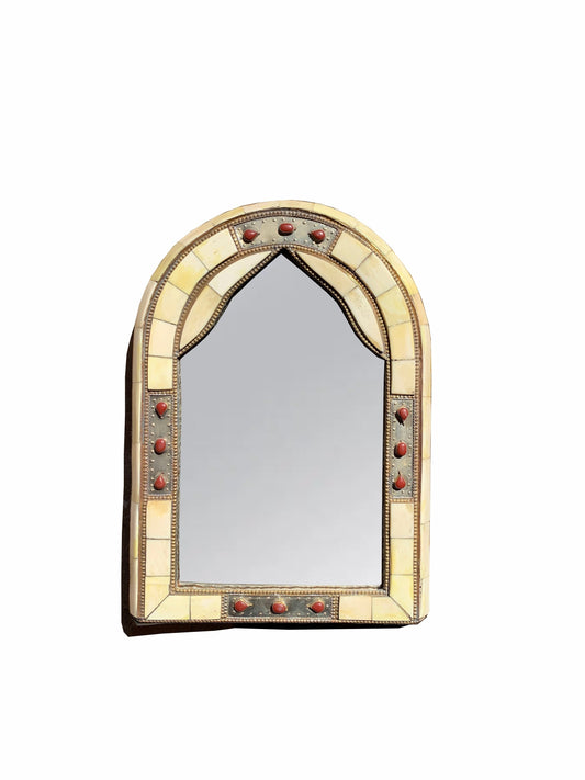 a mirror that is sitting on a wall