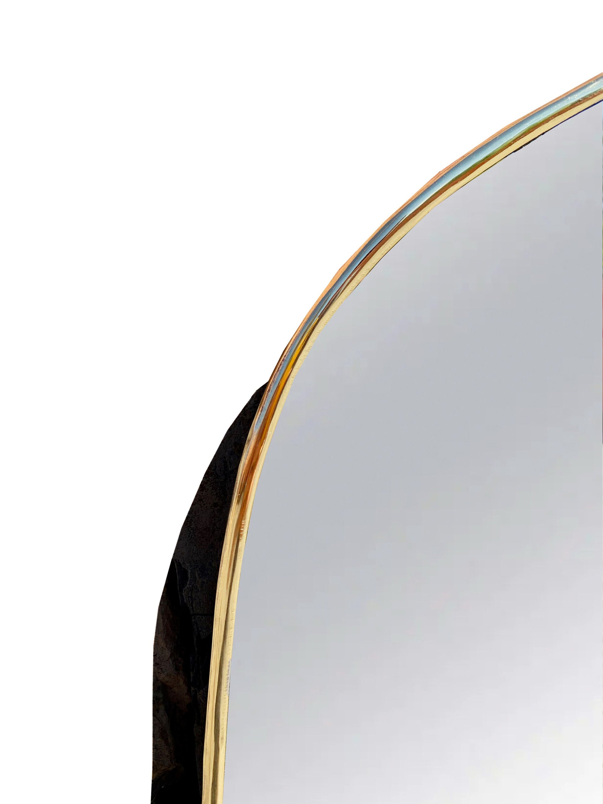 a mirror that has a curved edge on it