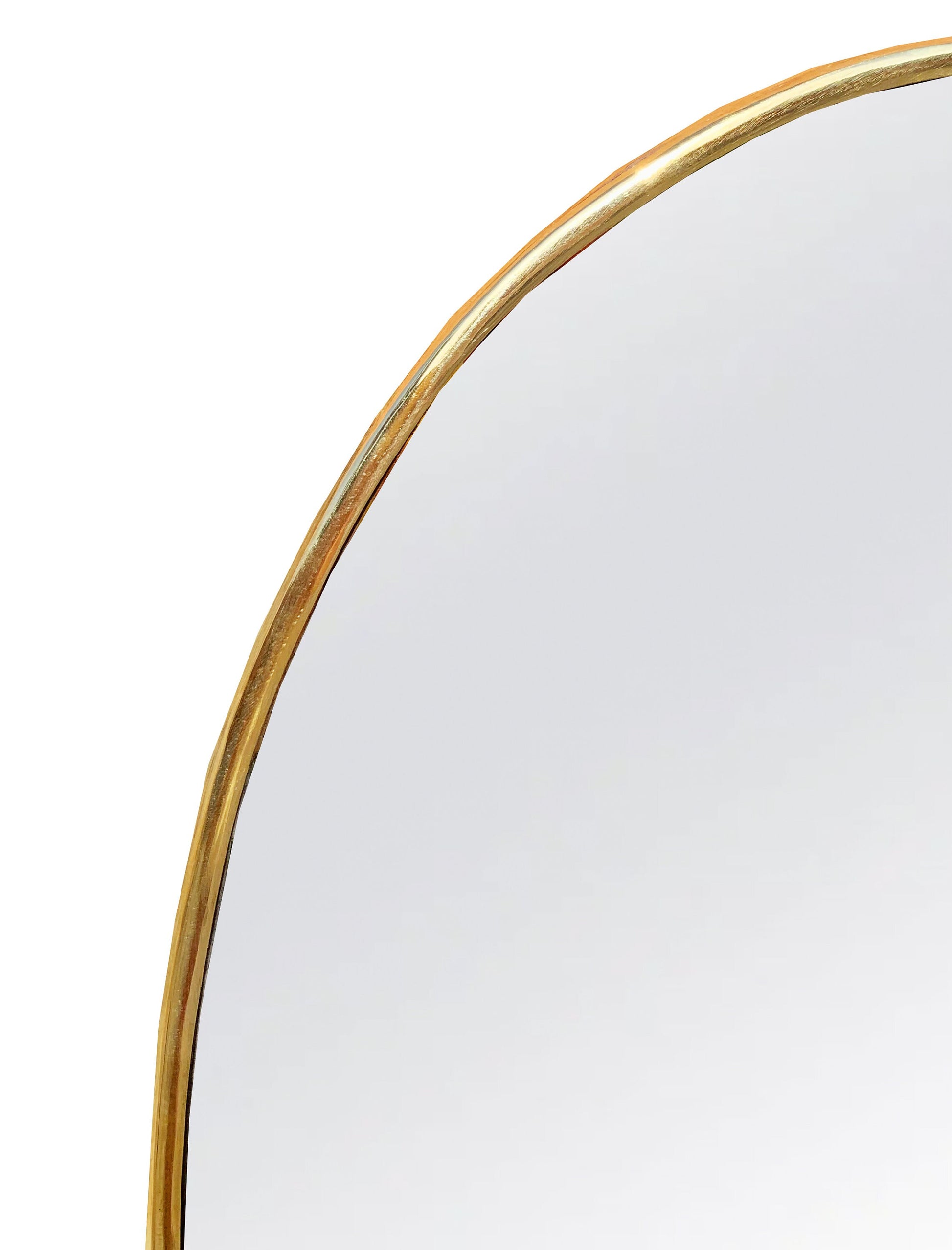 a mirror that has a gold rim around it