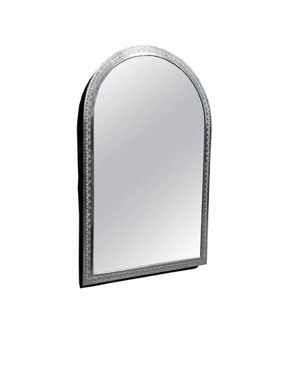 a mirror that is sitting on a wall