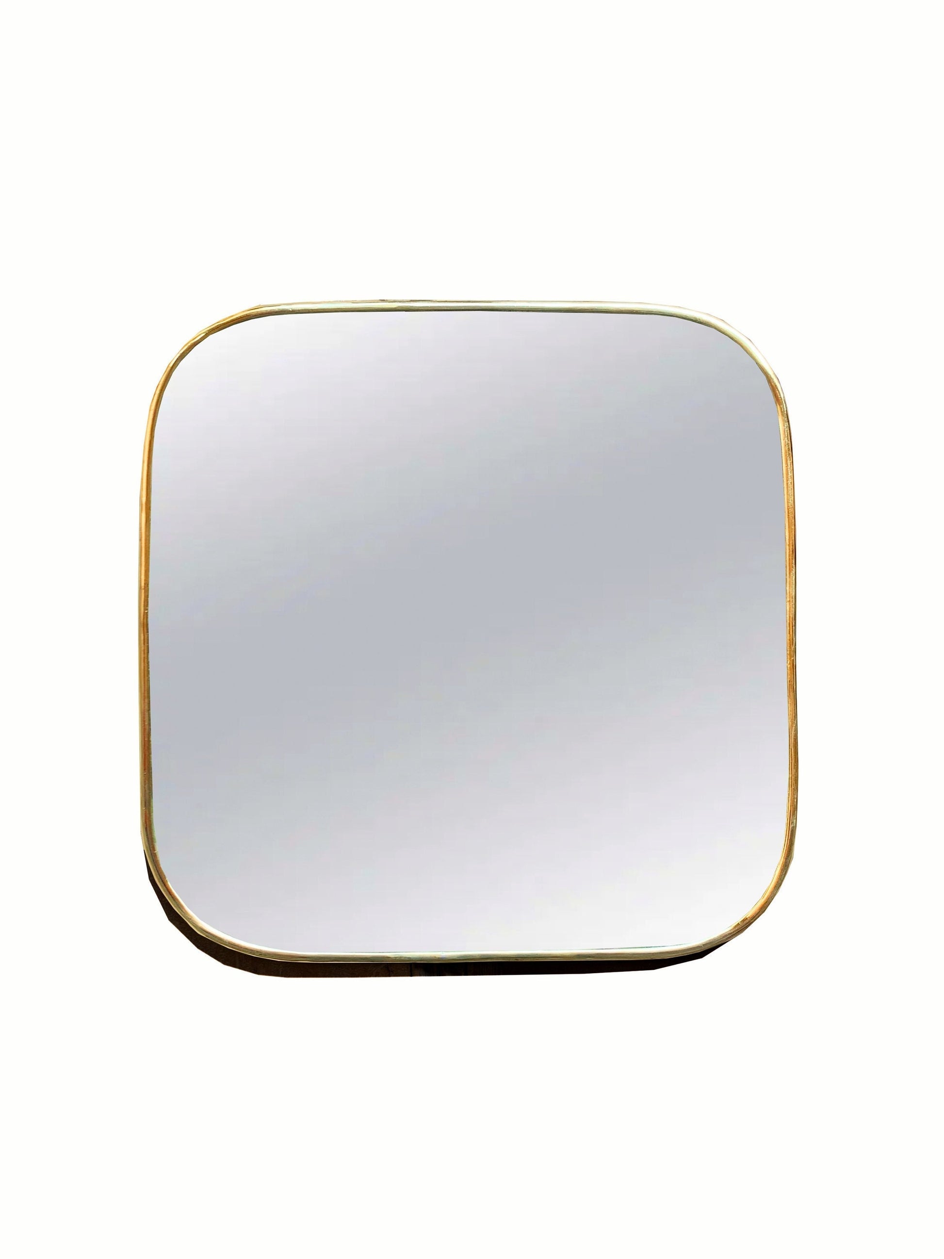 a square brass mirror with a gold frame on a white background