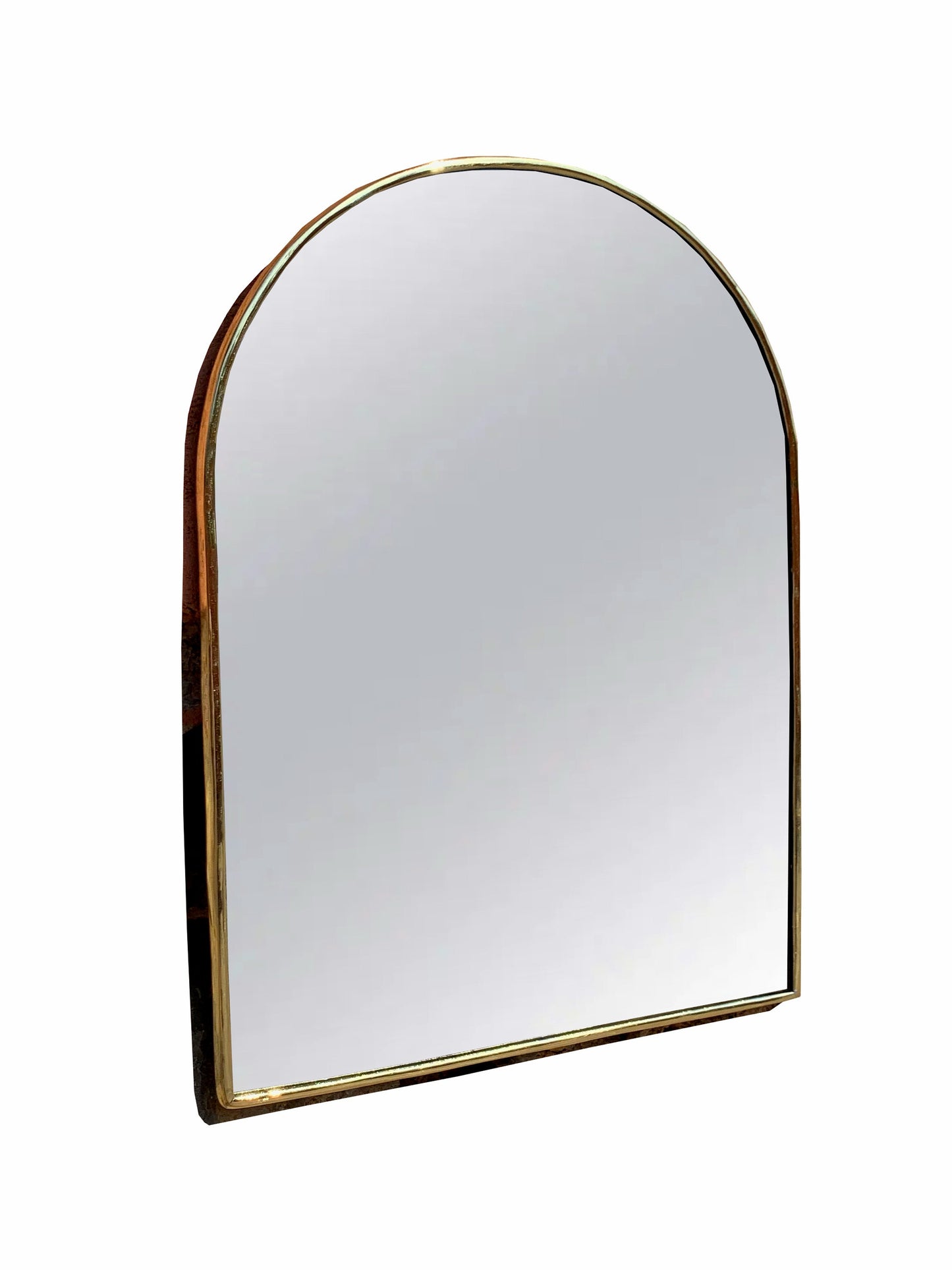 a mirror with a gold frame on a white background