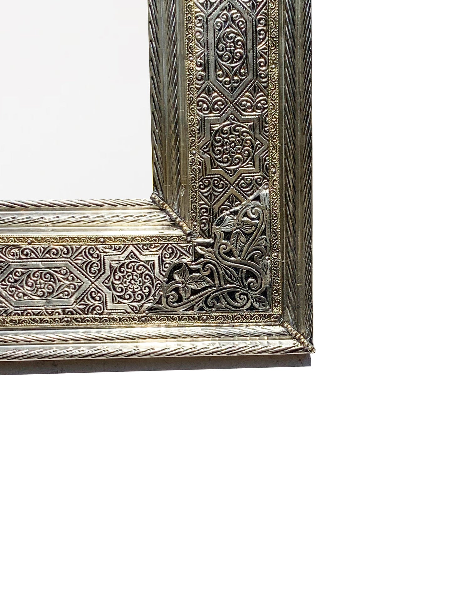 a silver picture frame sitting on top of a white wall