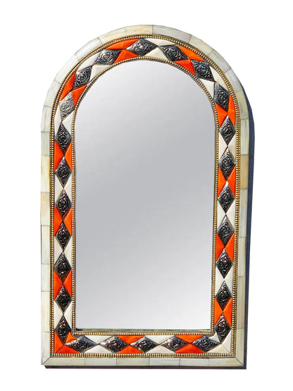 a decorative mirror with an orange and white border