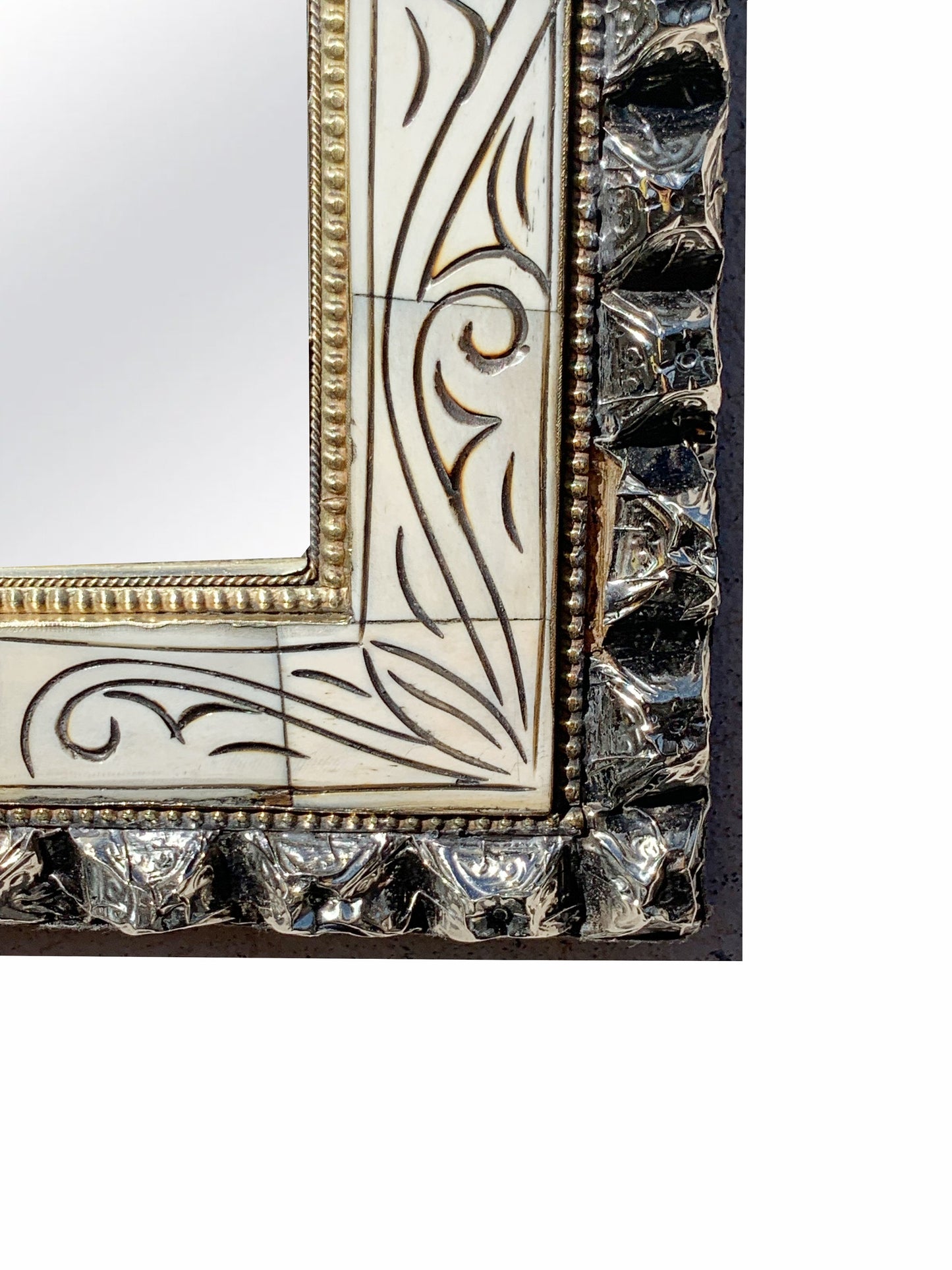 a white and gold framed mirror on a wall