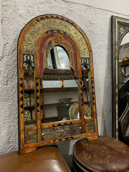 a mirror and a stool in a room