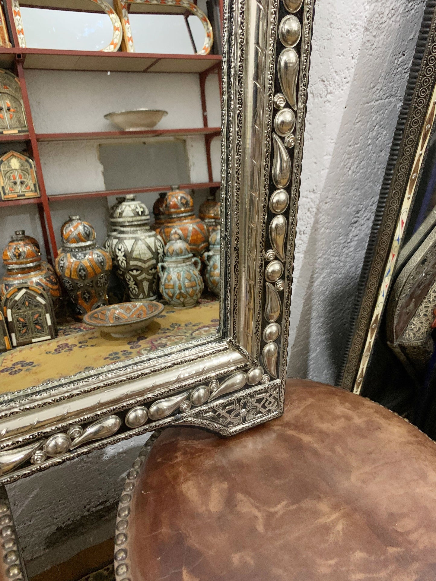 a mirror sitting on top of a wooden table