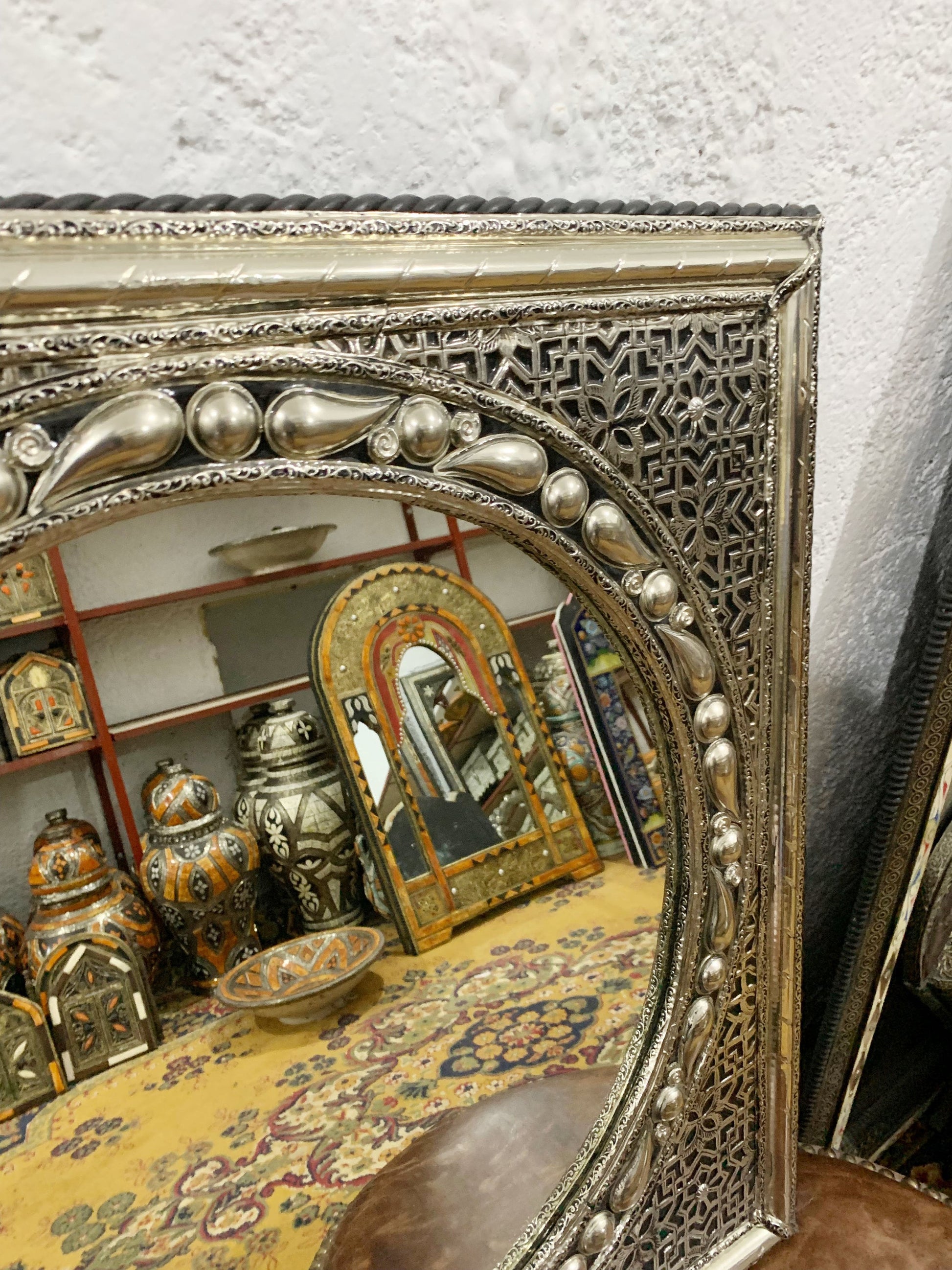 a mirror sitting on top of a wooden table