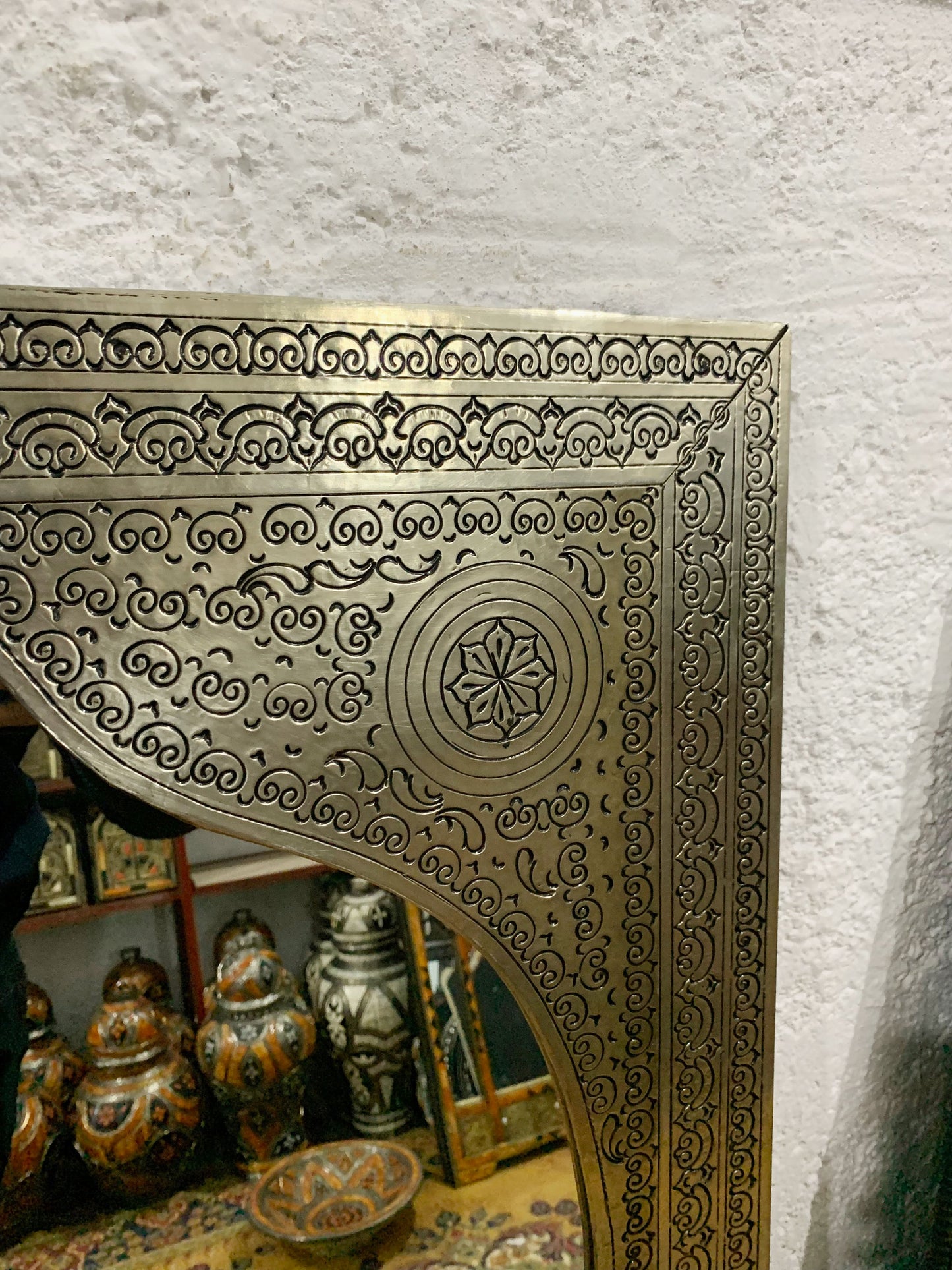 a mirror that has a design on it