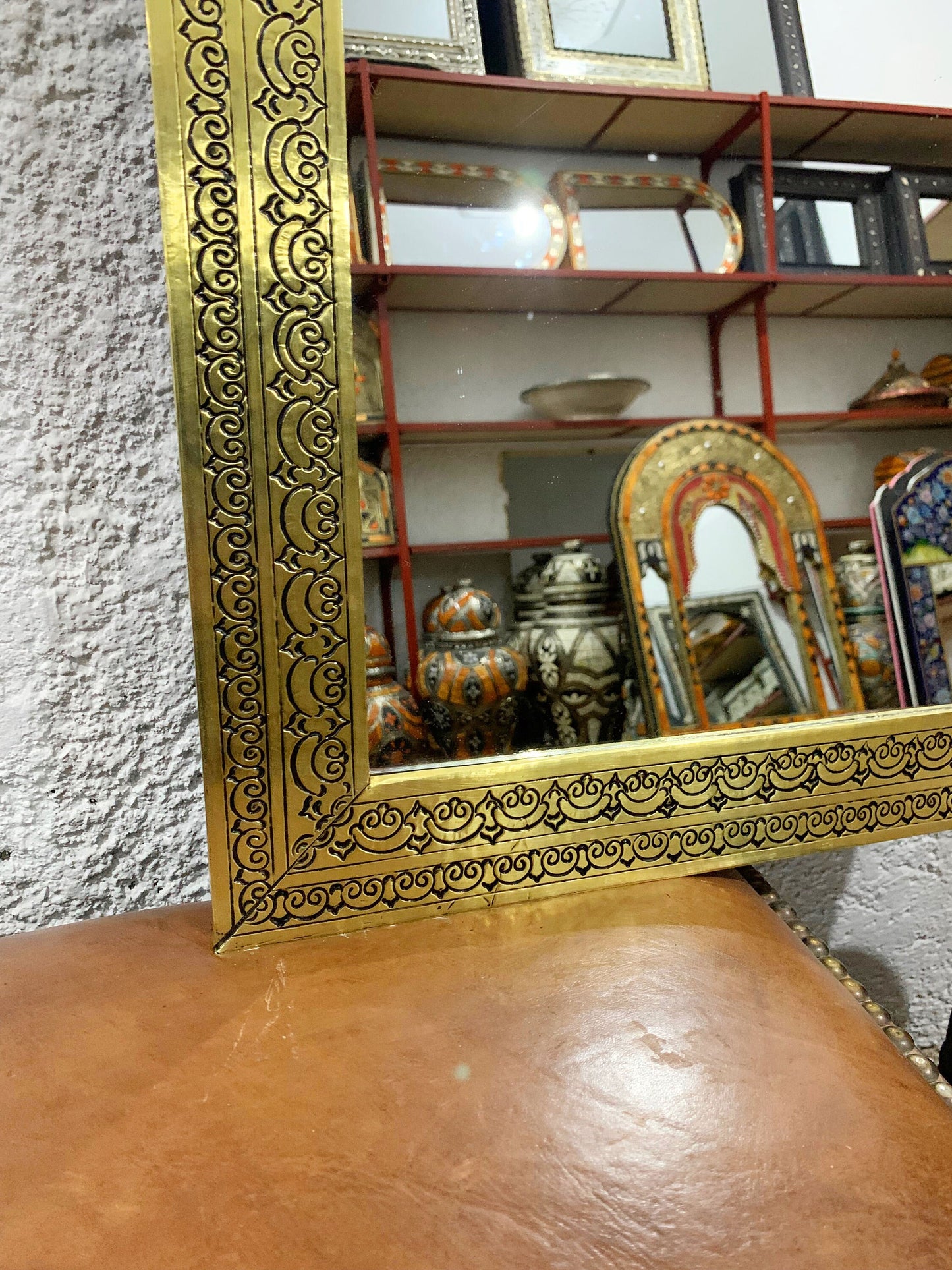 a mirror sitting on top of a wooden table