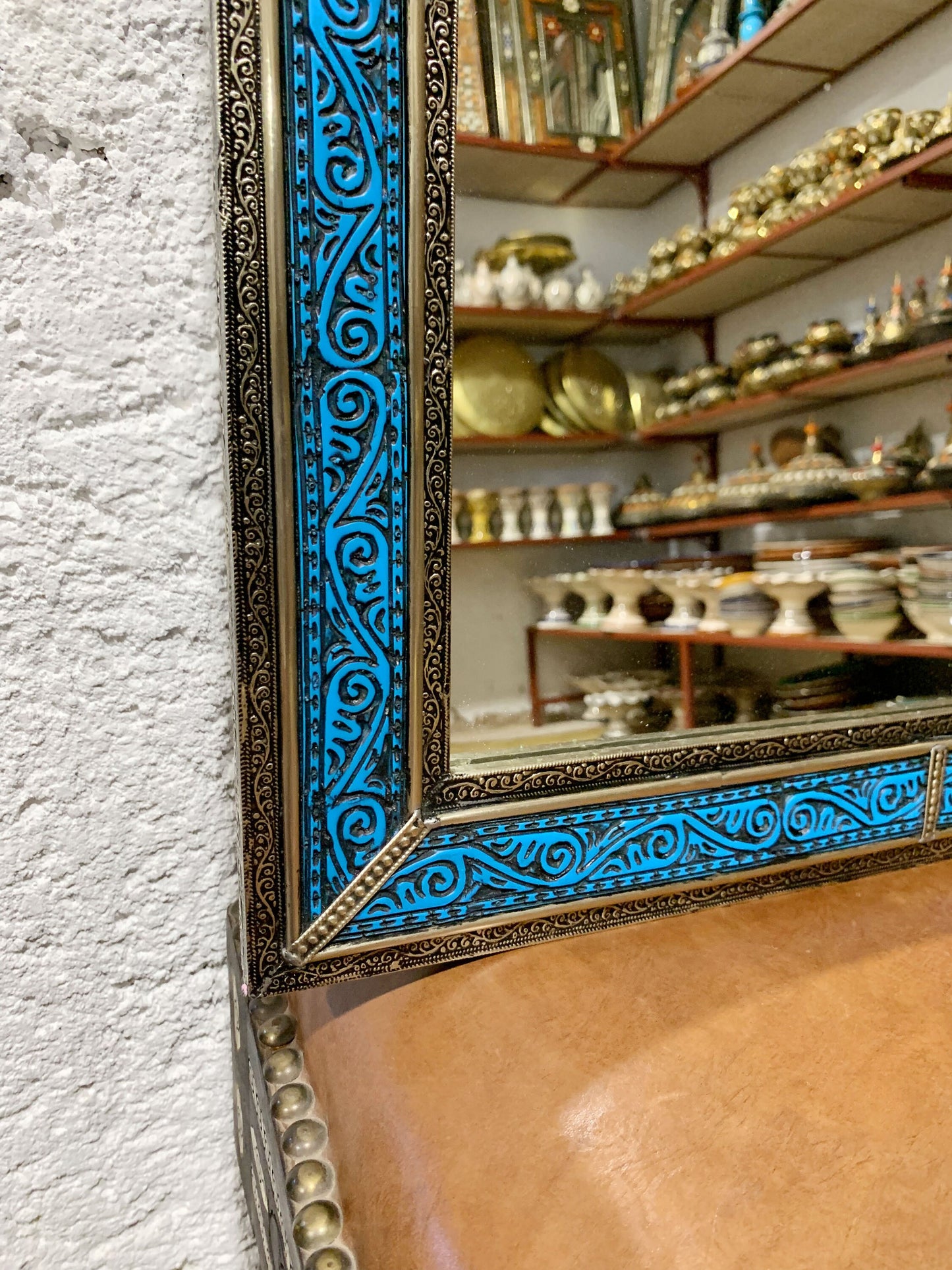 a mirror sitting on top of a wooden table