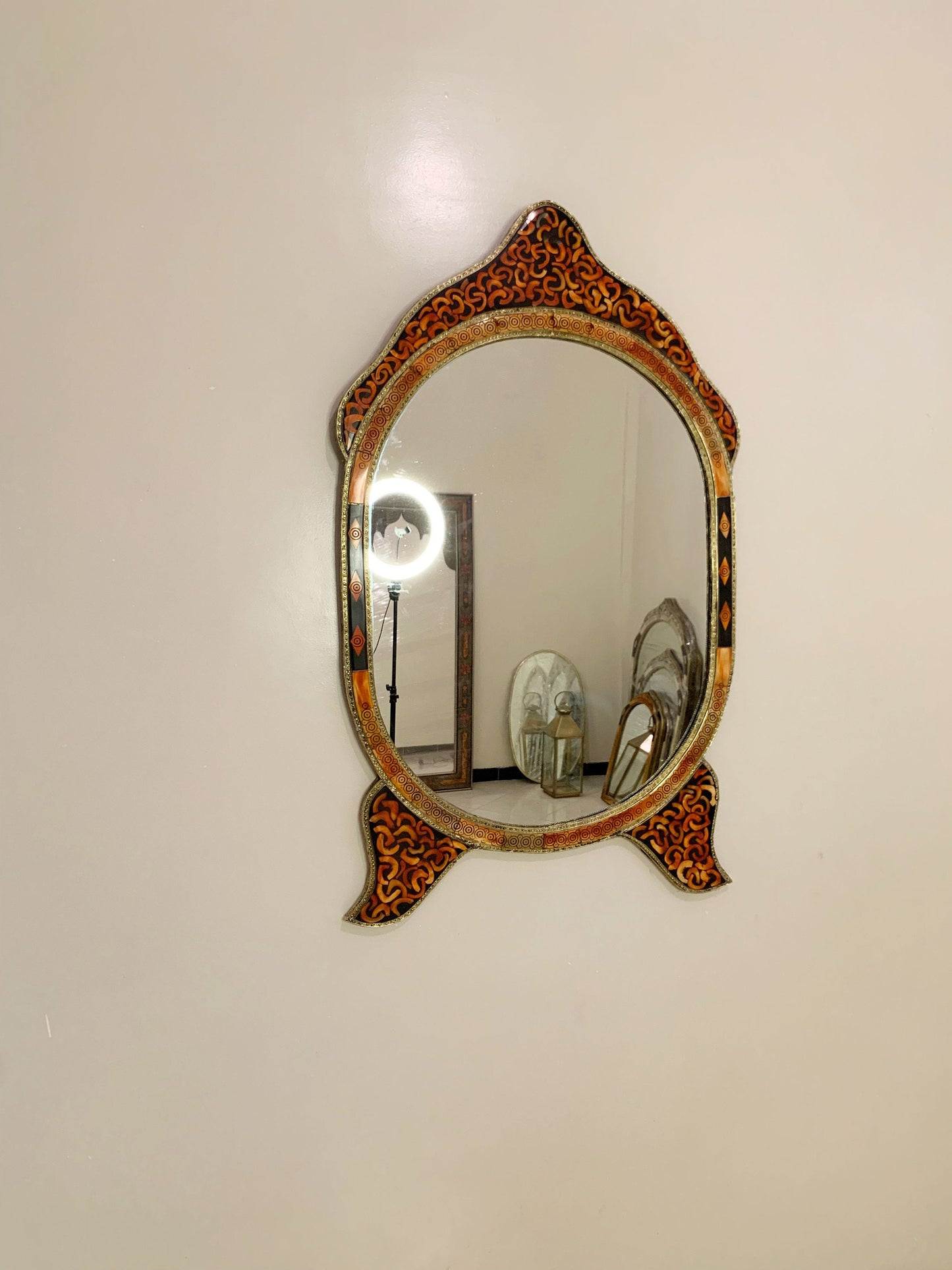 a mirror that is on the wall above a sink