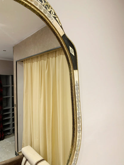 a mirror that has a curtain in front of it