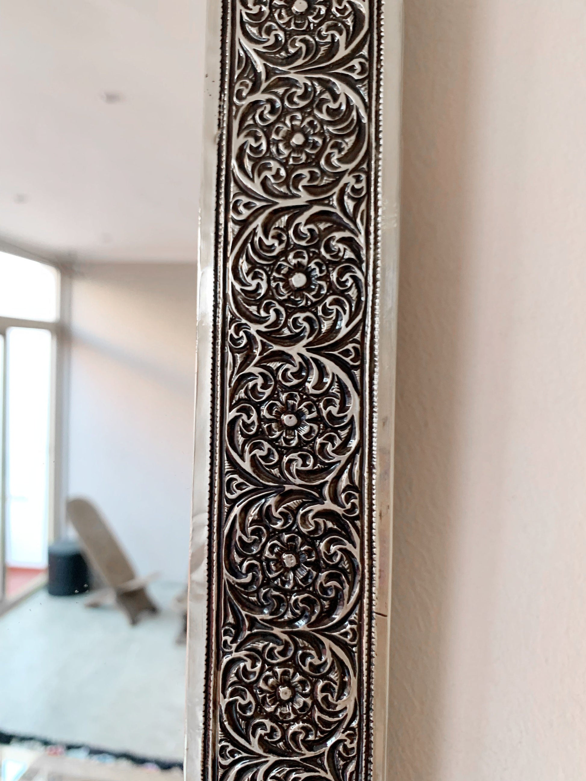 a door handle with a decorative design on it