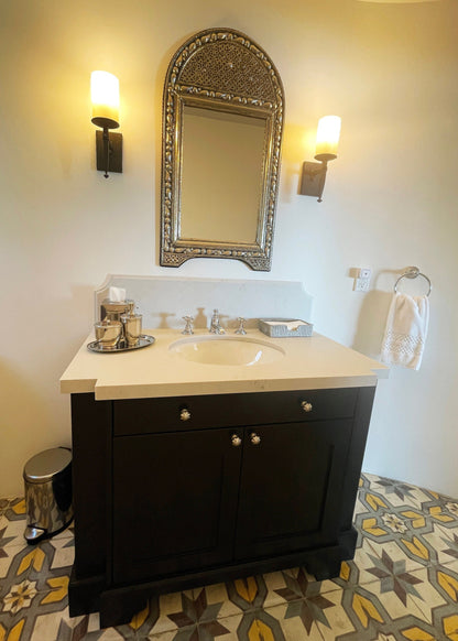 a bathroom with a sink and a mirror