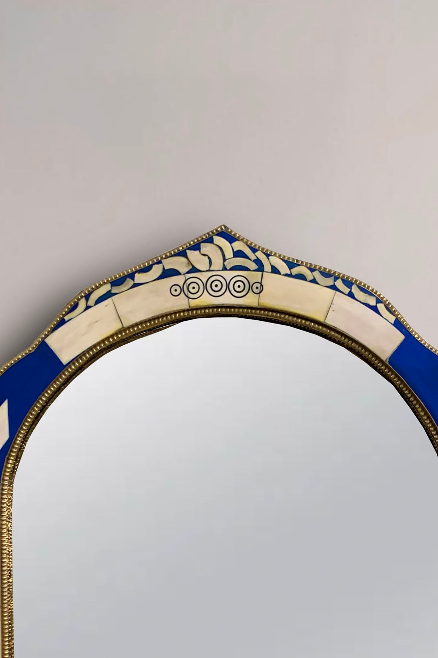 a mirror that is sitting on a wall