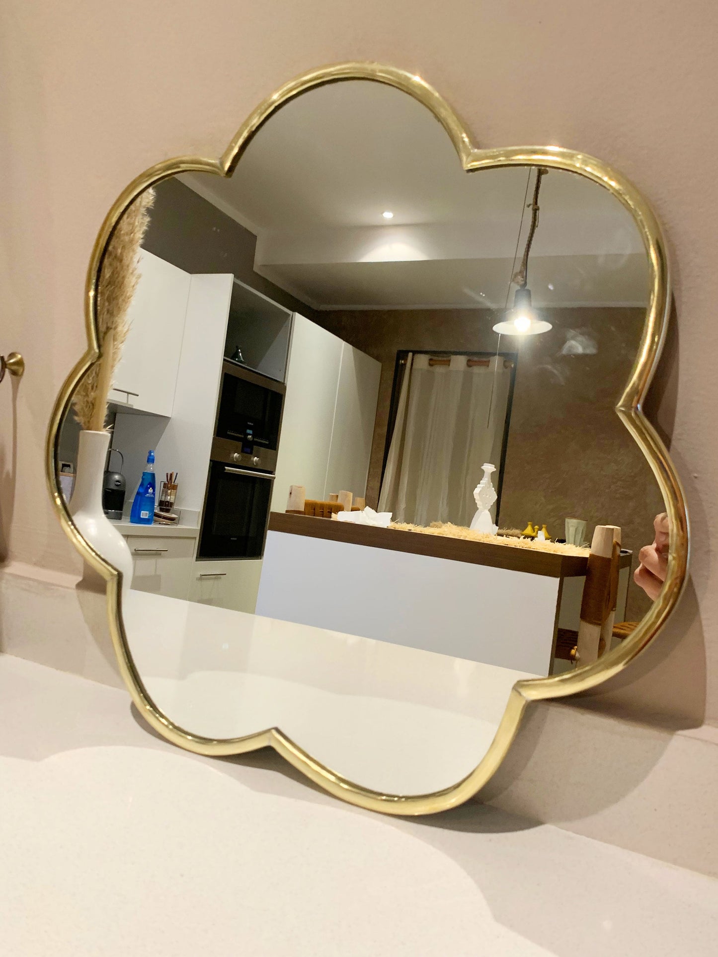a mirror that is on a table in a room