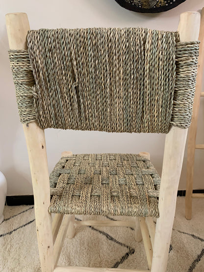 a wooden chair with a woven seat