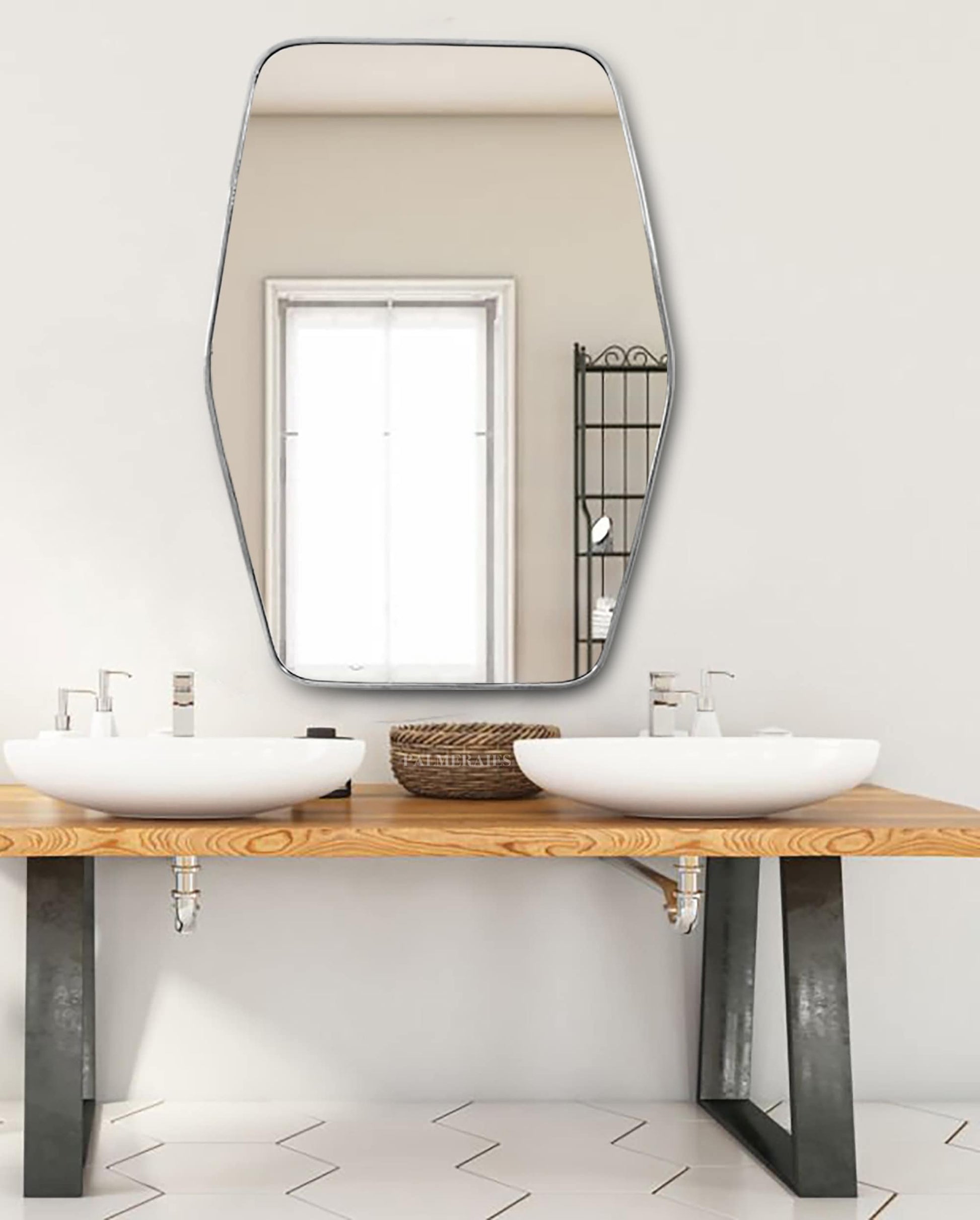 a bathroom with two sinks and a large mirror