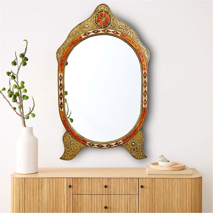 a mirror sitting on top of a wooden dresser