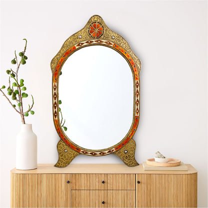 a mirror sitting on top of a wooden dresser