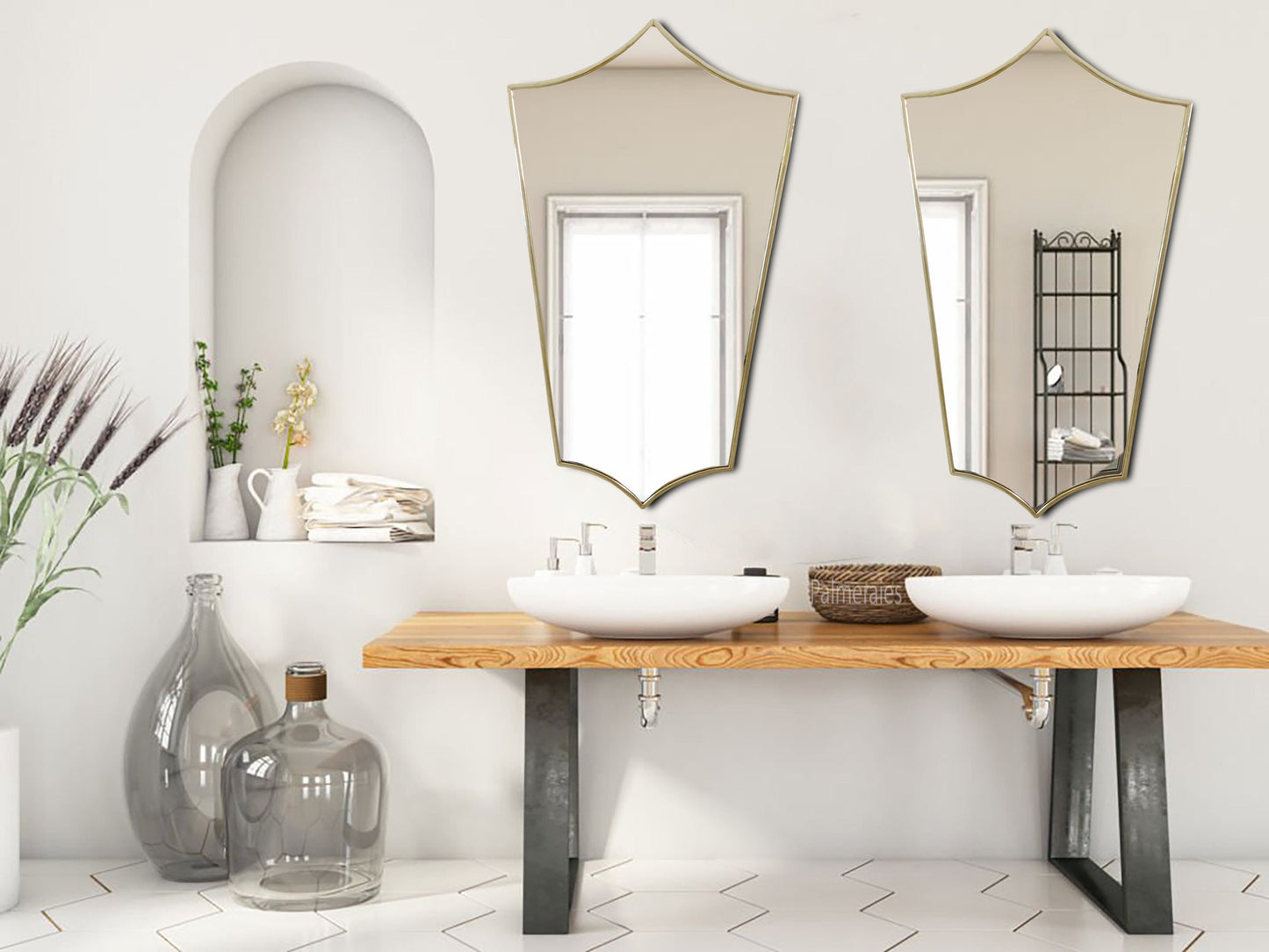 a bathroom with two sinks and mirrors on the wall