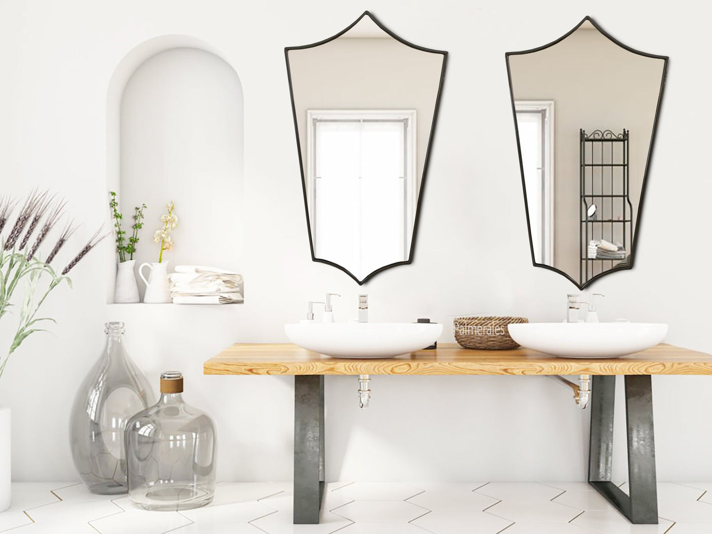 a bathroom with two sinks and mirrors on the wall