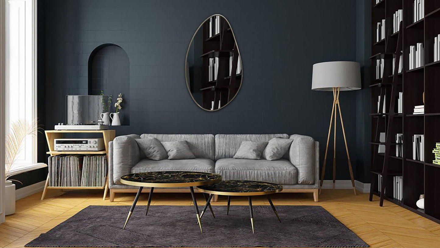 a living room with a couch, coffee table and bookshelf