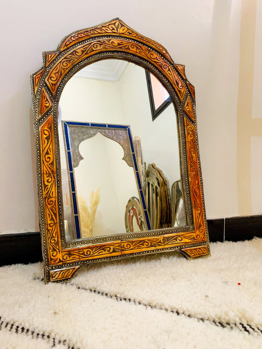 a mirror sitting on top of a white rug