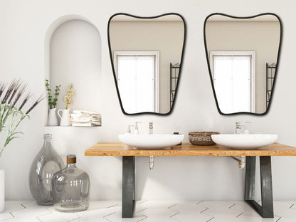 a couple of sinks sitting under two mirrors